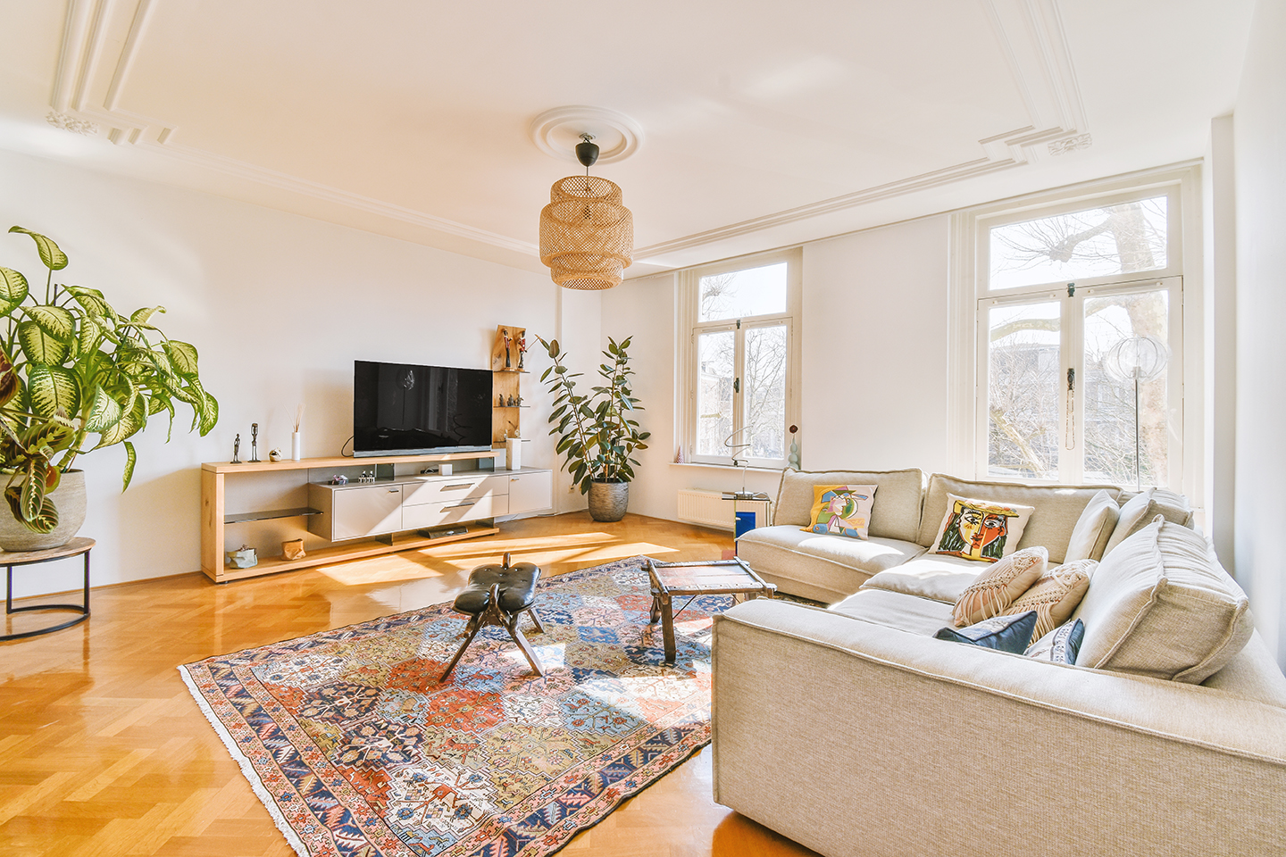 View from the interior of a living room staged for selling a house.